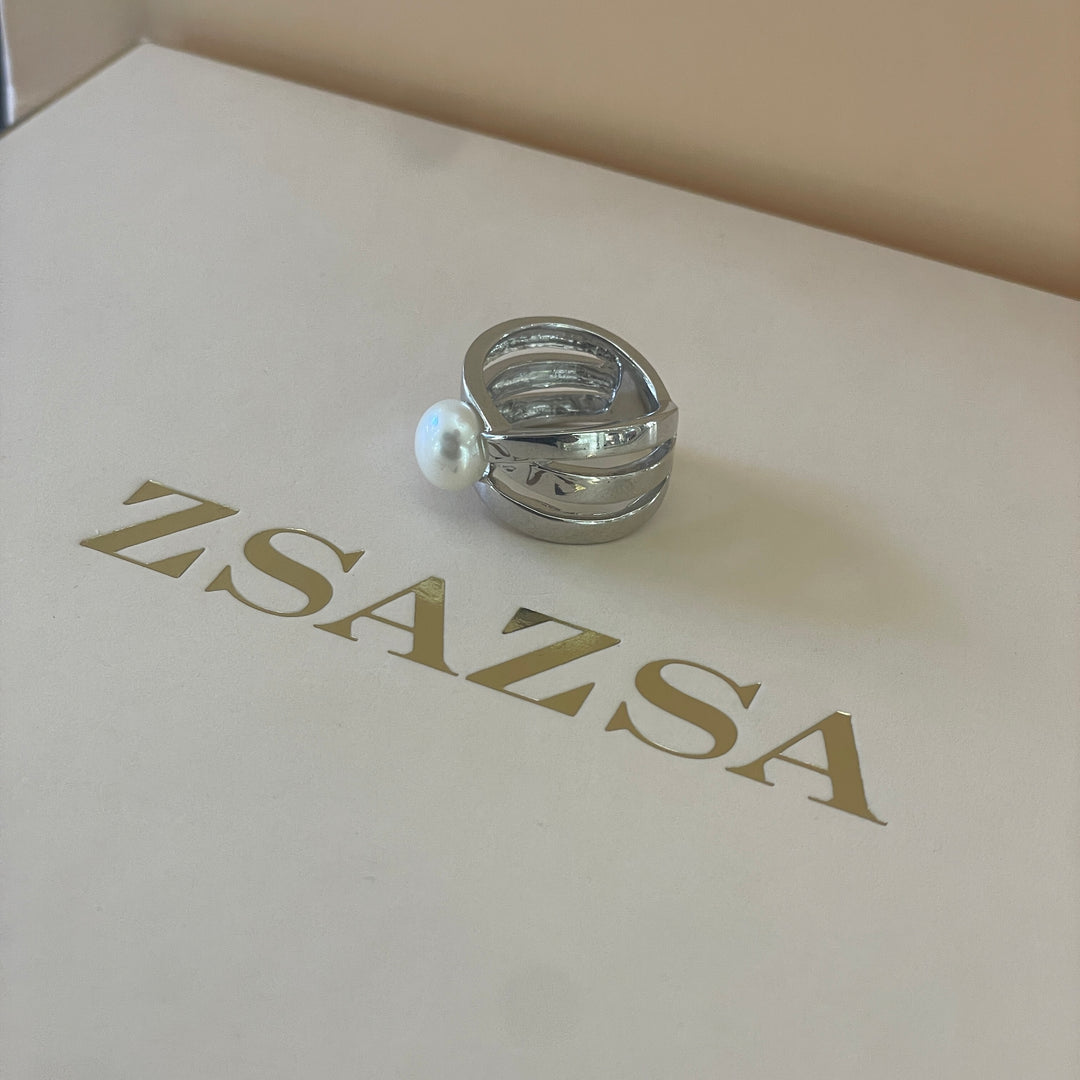 Silver crossed design with a dainty pearl ring in white gold plating
