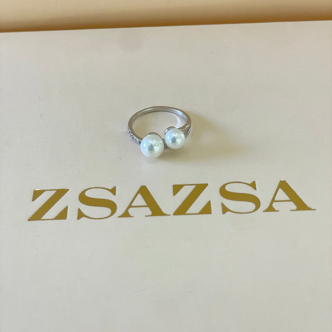 Silver 2 pearl ring with overlapping stones in white gold plating