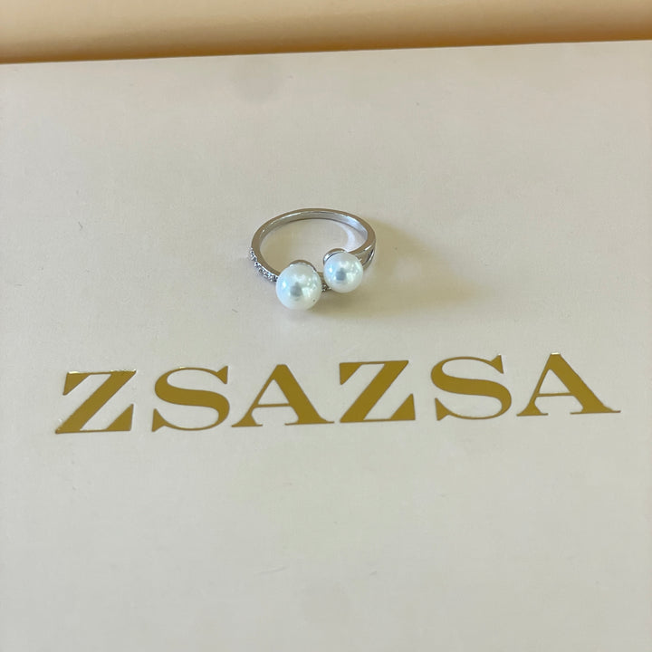 Silver 2 pearl ring with overlapping stones in white gold plating