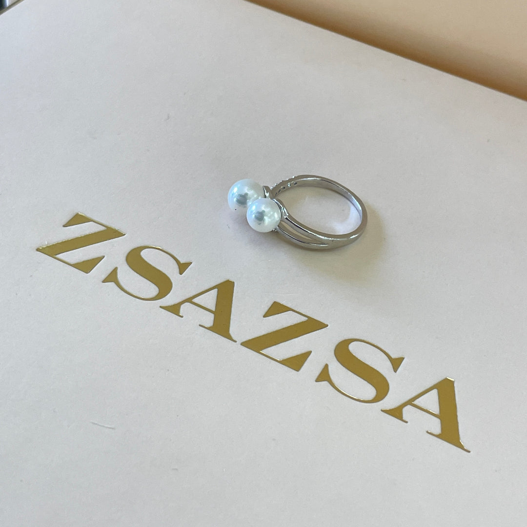 Silver 2 pearl ring with overlapping stones in white gold plating